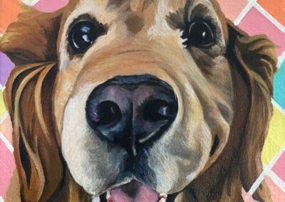 memorial pet portrait of a golden retriever against a colorful harlequin background